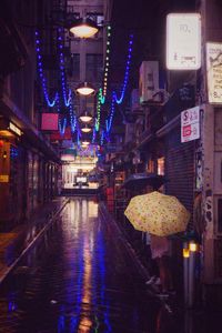 Illuminated lanterns hanging at night