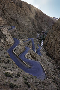 High angle view of road by mountain against sky