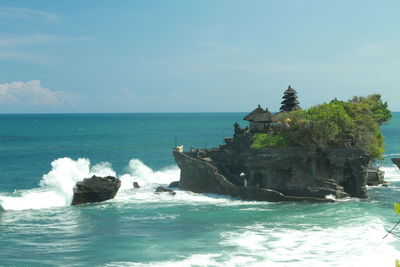 Scenic view of sea against blue sky