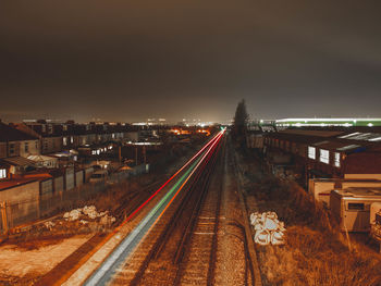 High angle view of light trails on highway at night