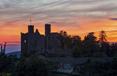 Buildings in city during sunset