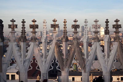 Crosses of duomo di milano against sky