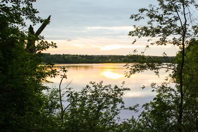 Scenic view of lake against sky during sunset