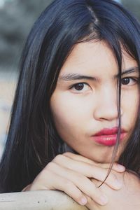 Portrait close-up of young beautiful asian model girl with red color mouth,shiny black hair