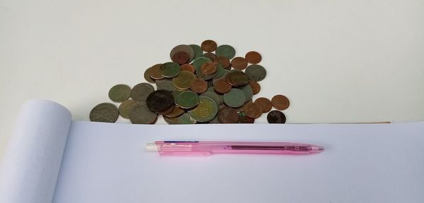 High angle view of coins on table