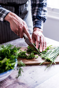 Close-up of man preparing food on table