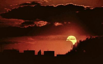 Built structure against cloudy sky at sunset