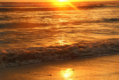 Scenic view of sea at sunset