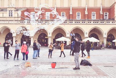 Group of people in front of historic building