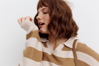 Young woman against white background