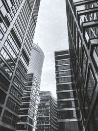 Low angle view of modern buildings against sky