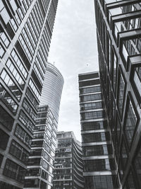 Low angle view of modern buildings against sky