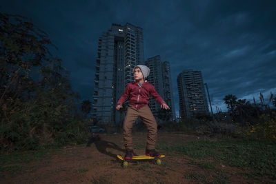Full length portrait of man standing against sky