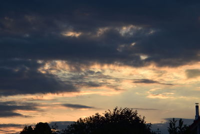Low angle view of dramatic sky during sunset