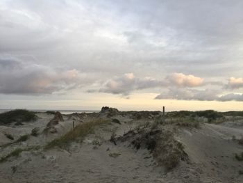 Scenic view of beach against sky during sunset