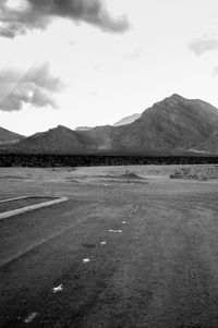 Scenic view of mountains against cloudy sky