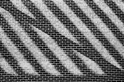 Full frame shot of bricked wall with stripes