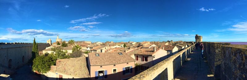 Panoramic view of aigues-mortes against blue sky