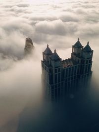 Built structures against cloudy sky
