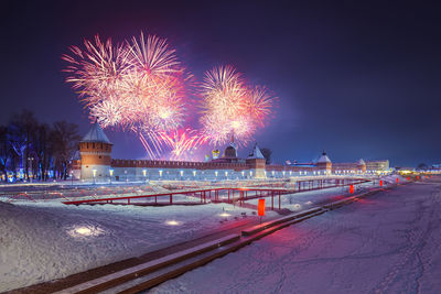 Fireworks in sky at night in tula, russia near kremlin at winter new year night