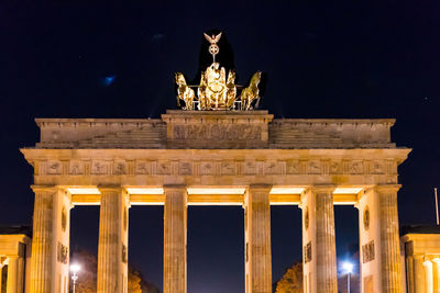 Low angle view of statue at night