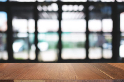 Close-up of wooden floor against wall