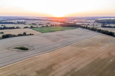 Scenic view of landscape against sky during sunset