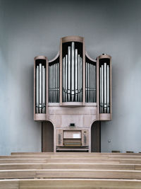 Pew and pipe organ at church