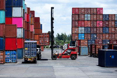 Stack of pier at harbor against sky
