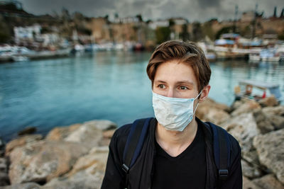 Portrait of young man standing outdoors