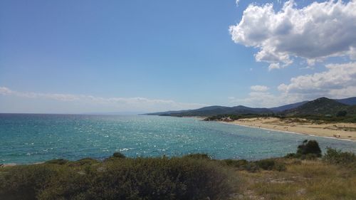 Scenic view of sea against blue sky