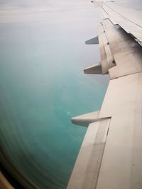 Airplane flying over sea