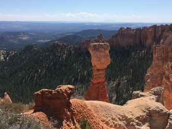 Scenic view of rock formations against sky