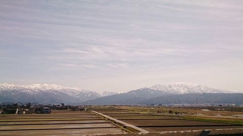 Scenic view of snowcapped mountains against sky