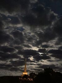 Low angle view of building against cloudy sky