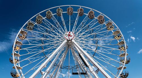 Low angle view of ferris wheel against sky