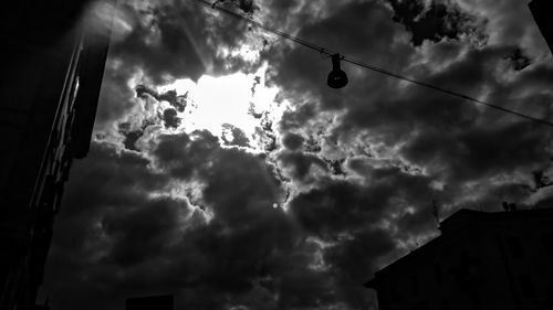 Low angle view of building against cloudy sky