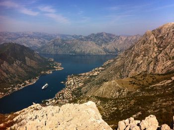 Scenic view of lake and mountains against sky