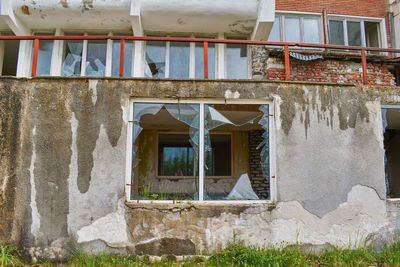 Broken windows of an abandoned hotel