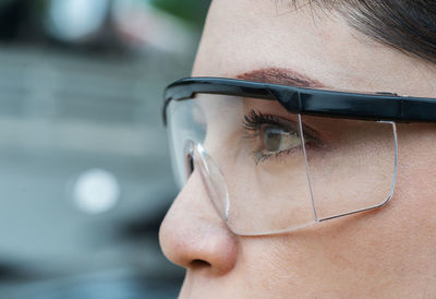 Close-up portrait of woman wearing eyeglasses