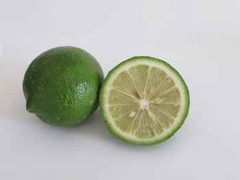 Close-up of fruit over white background