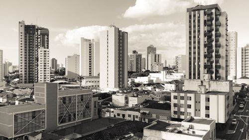 Modern buildings in city against sky