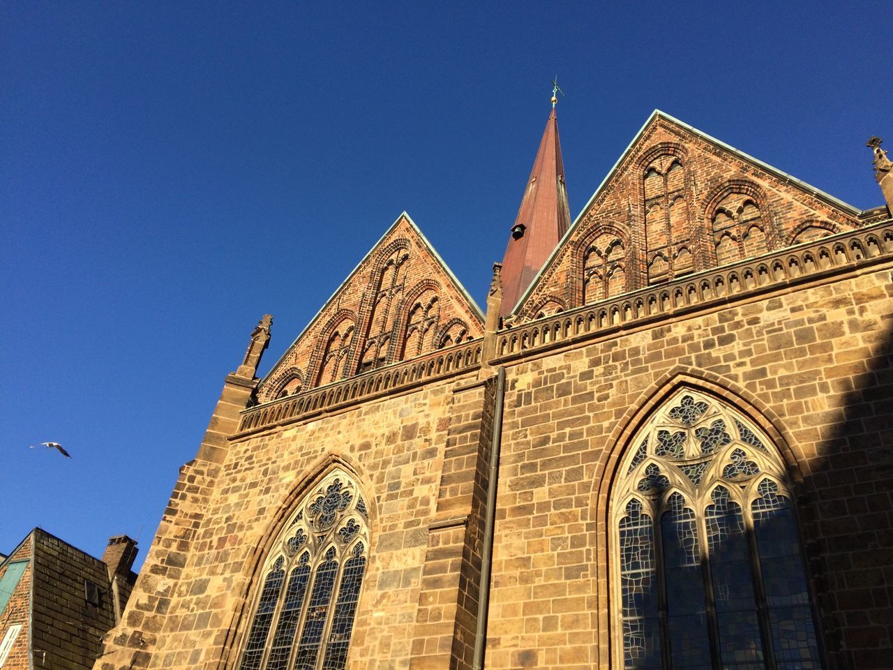 LOW ANGLE VIEW OF CATHEDRAL AGAINST SKY AND BUILDING