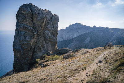 Rock called devil's finger in the karadag nature reserve against the blue sky. black sea. crimea