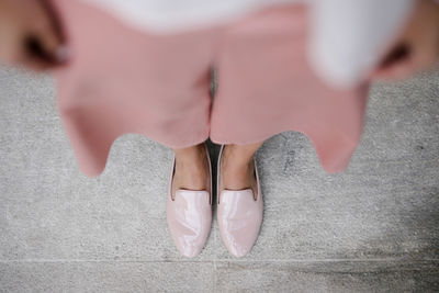 Low section of woman standing on floor