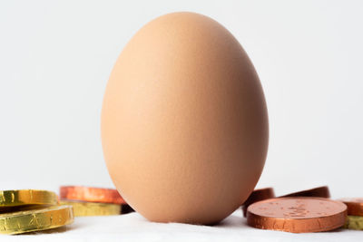 Close-up of eggs against white background