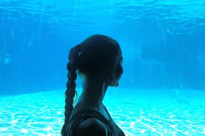 Portrait of woman swimming in sea