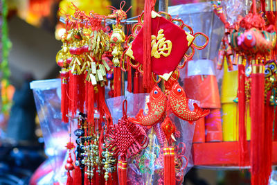 Close-up of multi colored hanging for sale in market