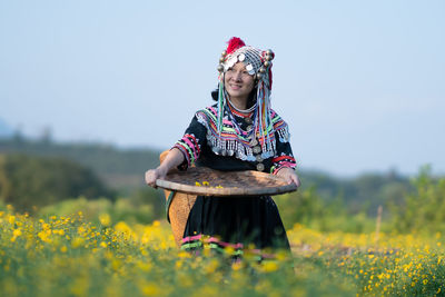 Full length of woman standing on field