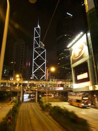 Illuminated road in city at night